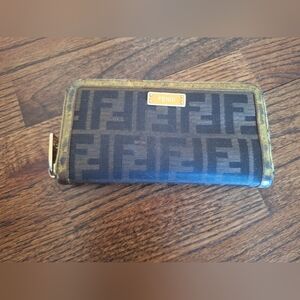 Women’s Fendi Zucca fabric zip around wallet.